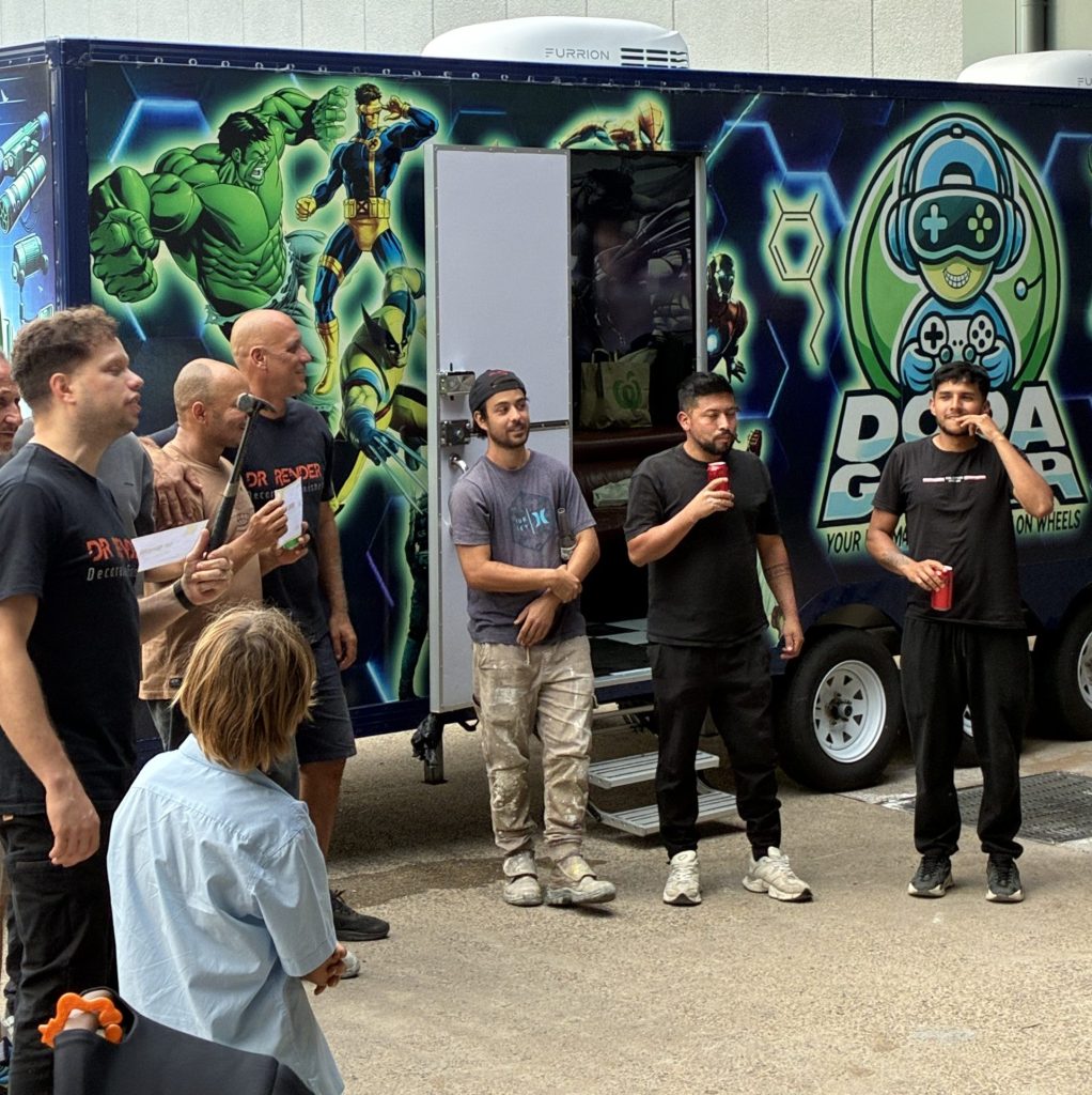 On-site corporate team building Sydney idea: A professional mobile game truck setup for staff parties and employee engagement events.